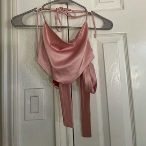 Really cute light pink top ties in the back! I loved this top!